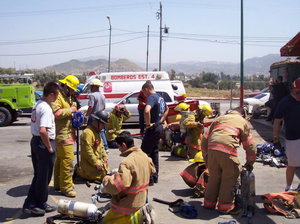 Tecate Fire Department firefighters putting on their bunker gear